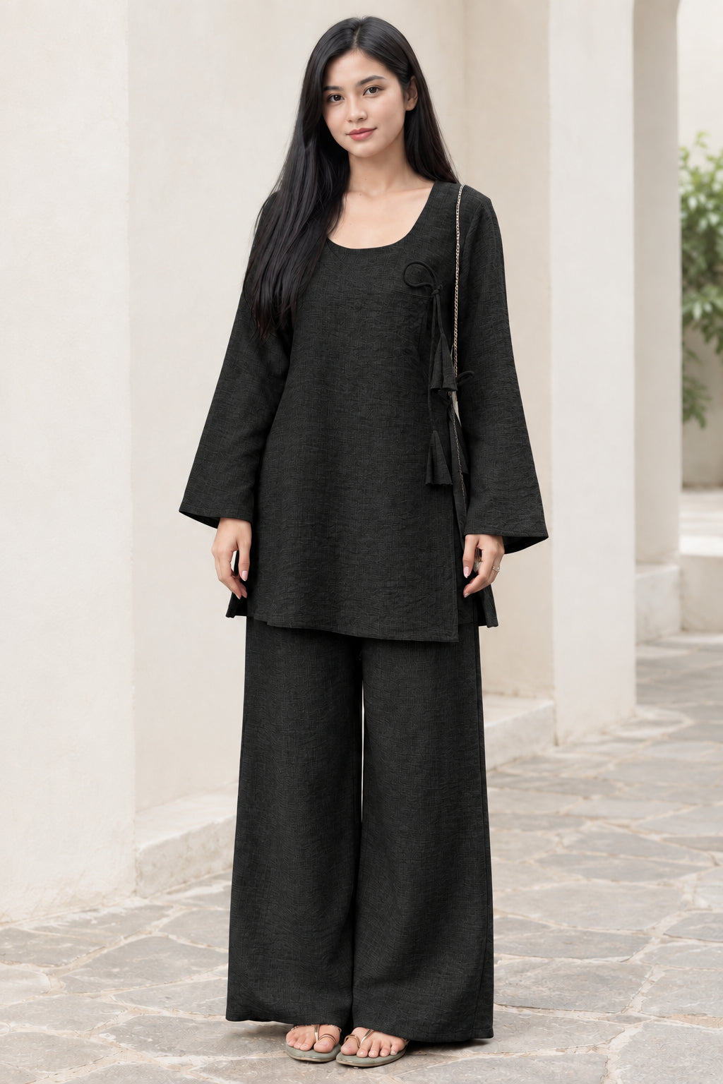 Front view of woman wearing Black two-piece relaxed tunic top and wide leg pants set
