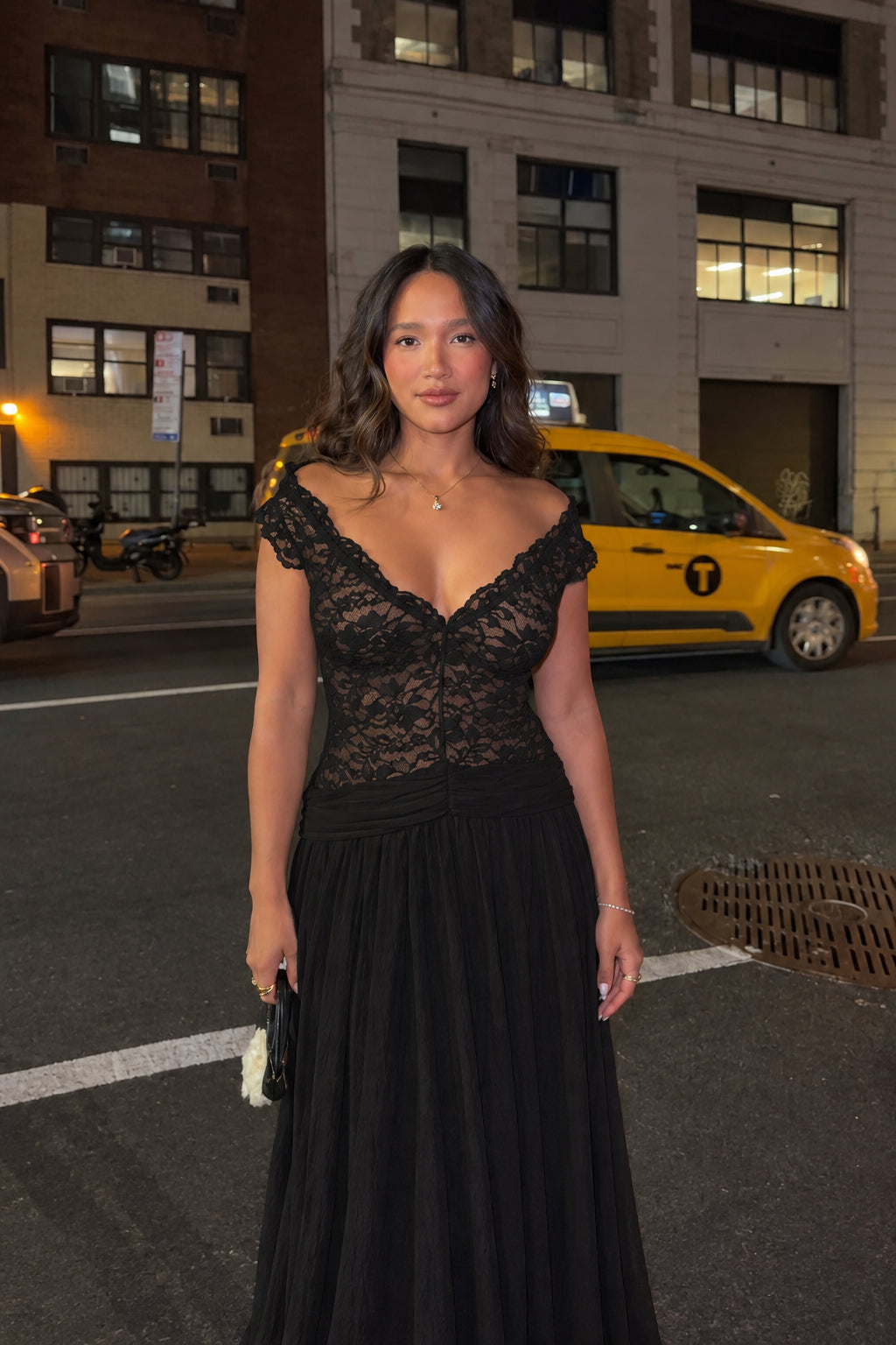 Woman wearing black lace V-neck formal maxi gown