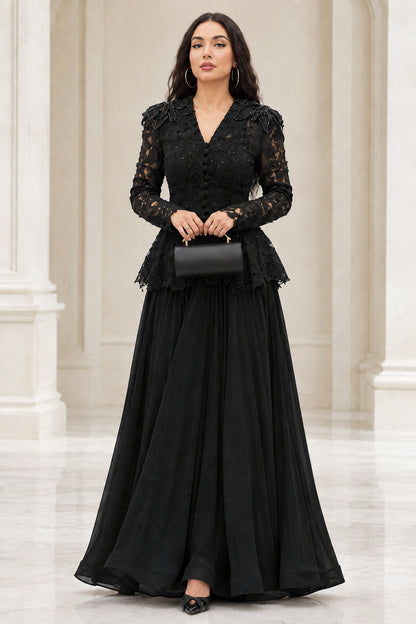 Model wearing black long sleeve lace peplum maxi evening gown