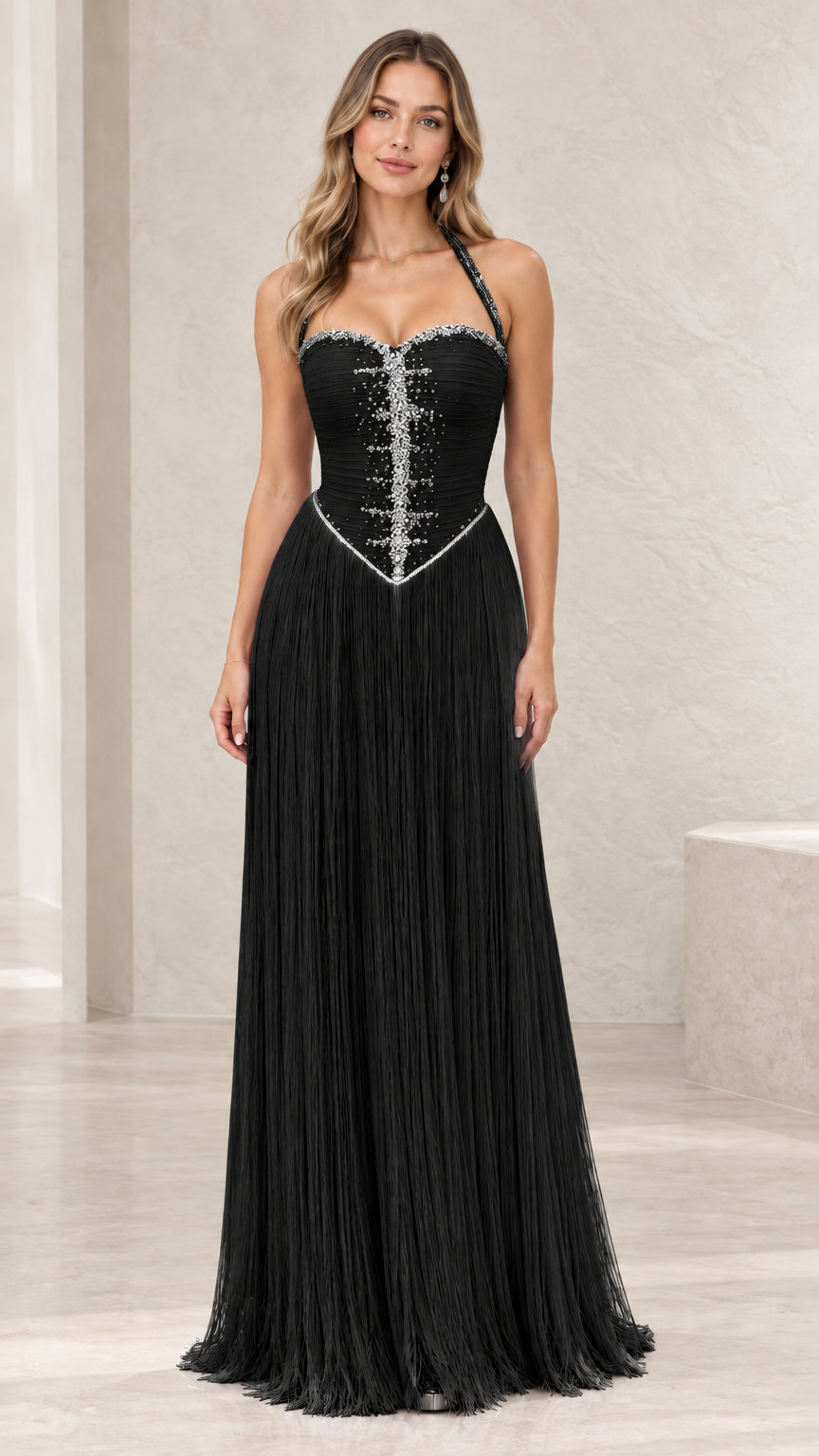 Full-length view of black rhinestone halter fringe evening gown