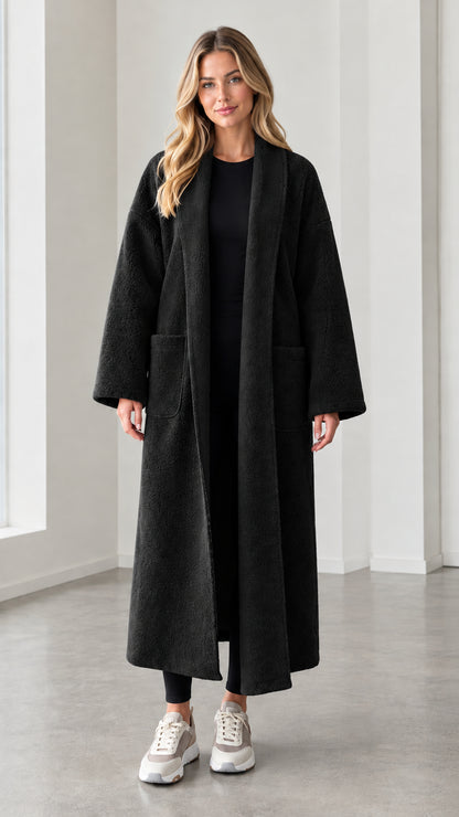 Model wearing black textured longline open front duster coat