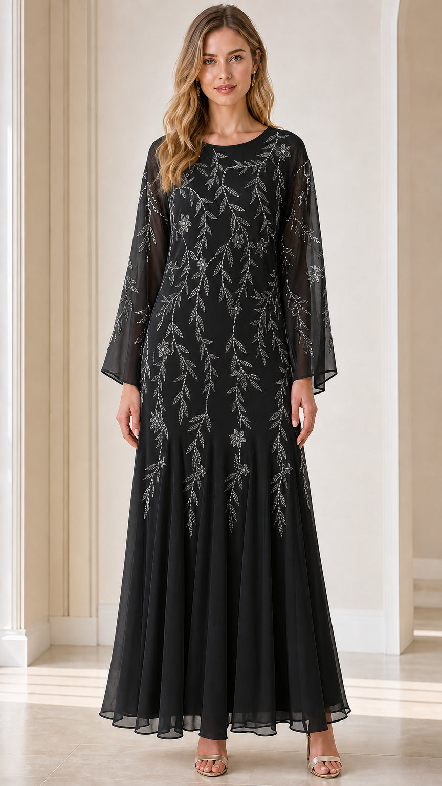 Front view of model wearing black sequin embroidered maxi dress