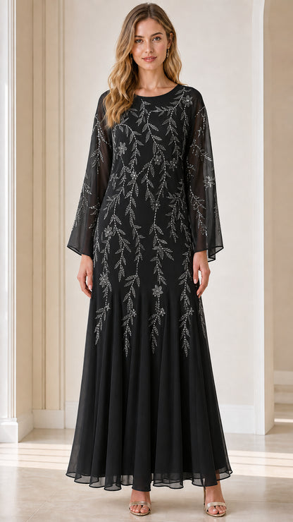 Front view of model wearing black sequin embroidered maxi dress