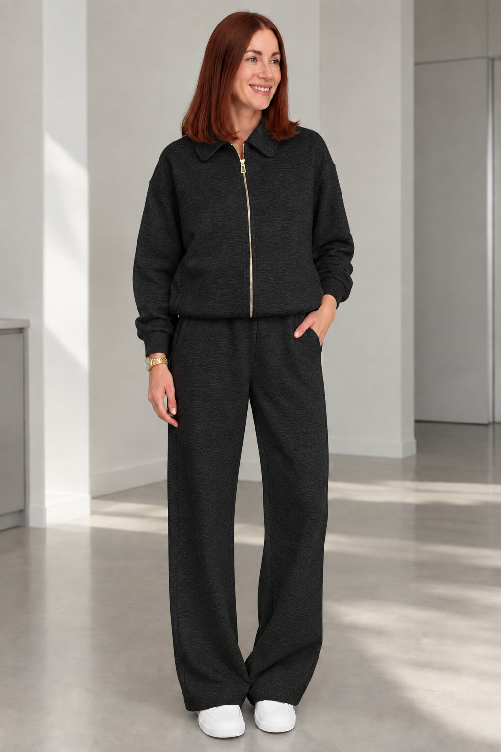 Woman wearing Black collared zip-up jacket and wide-leg lounge set