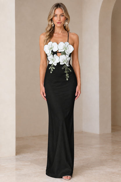 Front view of model wearing Black 3D floral cutout maxi gown