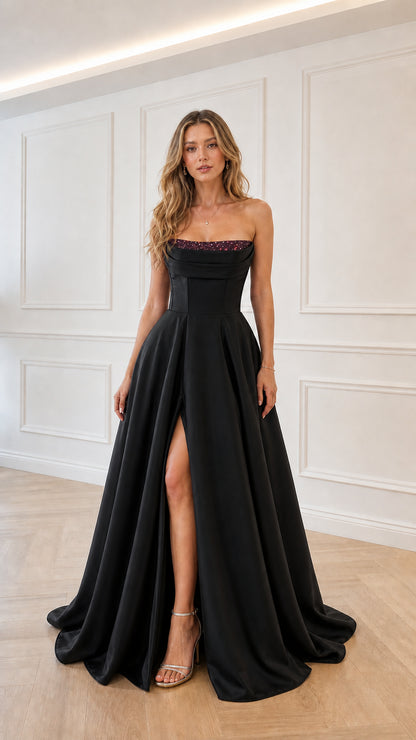Model wearing black satin strapless evening gown