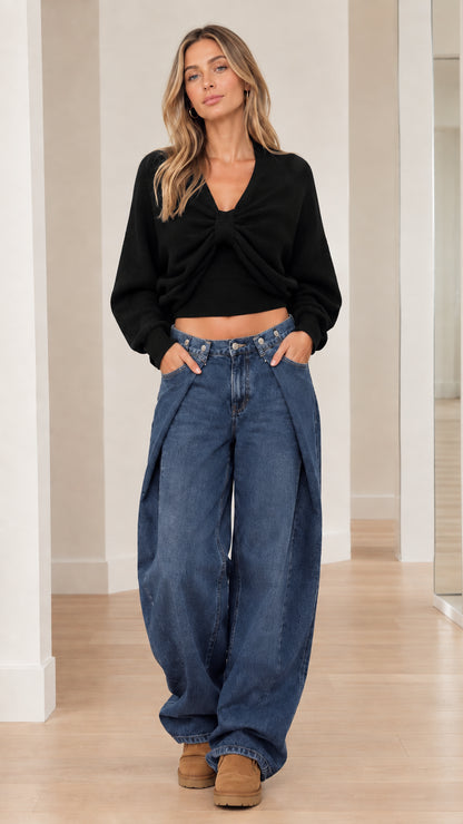Model wearing Black twist-front cropped V-neck knit sweater