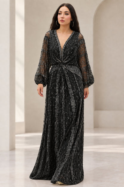 Front view of Black beaded long sleeve maxi evening gown