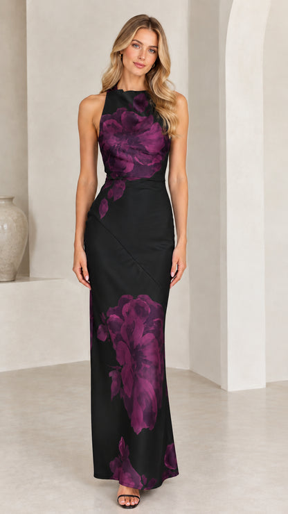 Front view of black floral print halter neck satin maxi dress