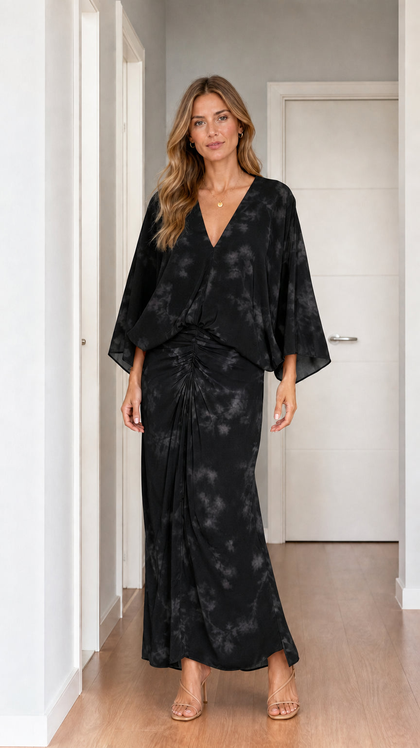 Model wearing black tie-dye two-piece set