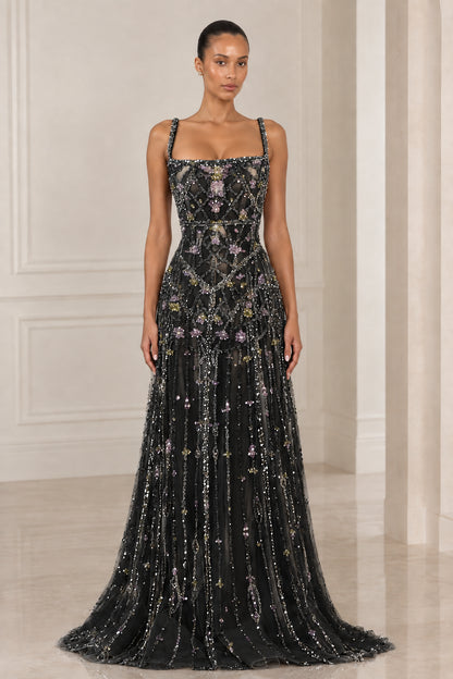 Front view of model wearing Black crystal embellished square neck evening gown