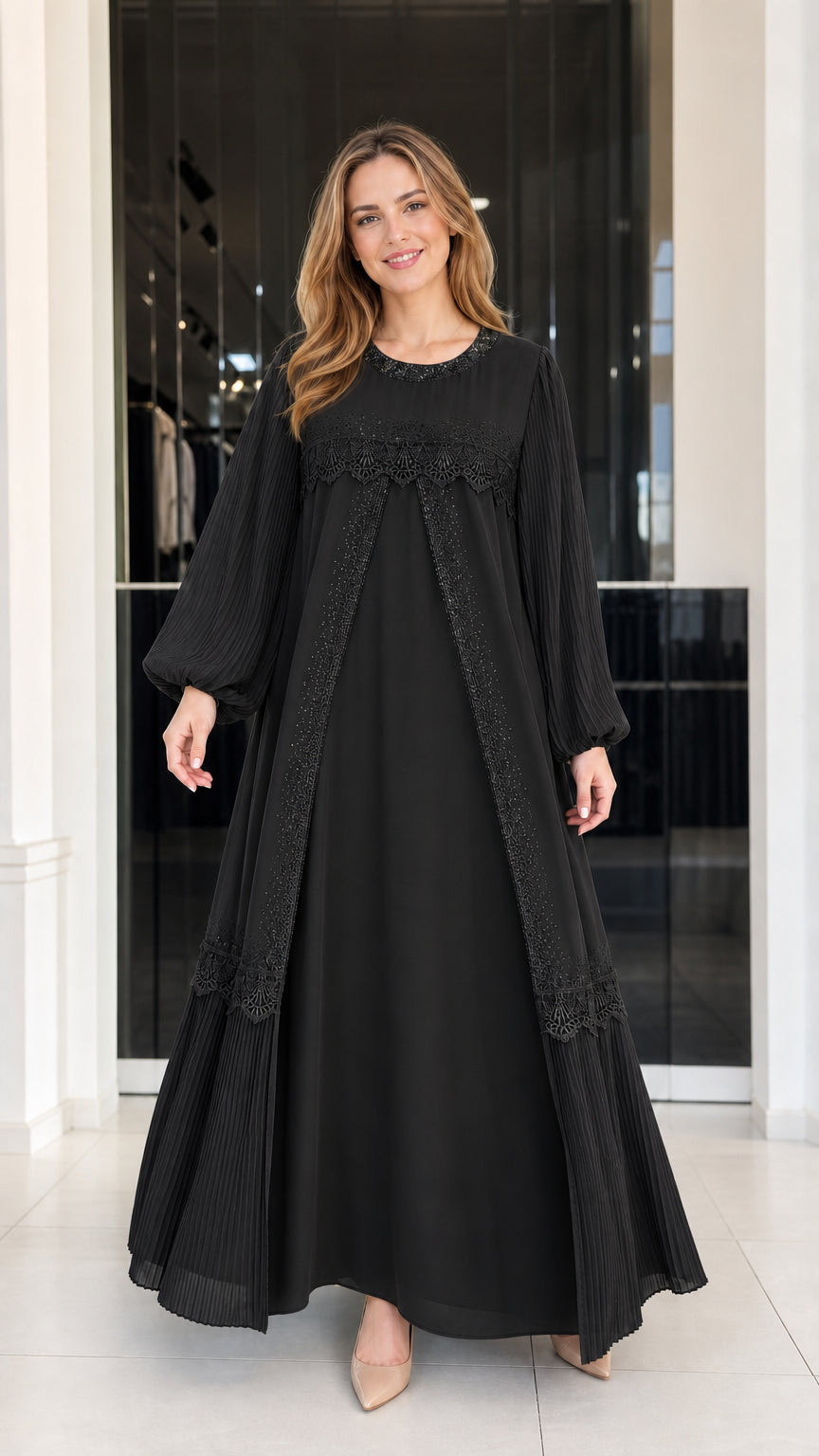 Front view of woman wearing black pleated balloon sleeve modest lace maxi dress