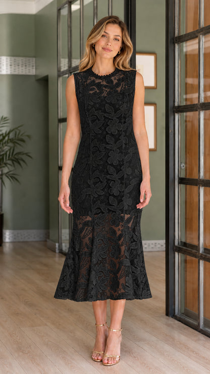 Front view of model wearing black sleeveless lace mermaid midi dress