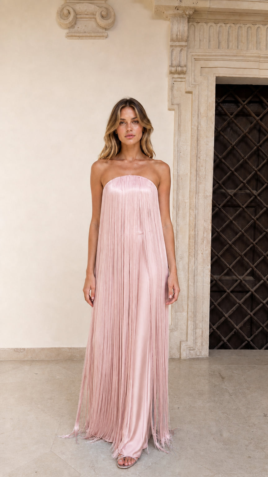 Model wearing Blush Pink strapless fringe maxi dress