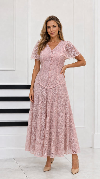 Full-length view of blush pink floral lace maxi dress with button front