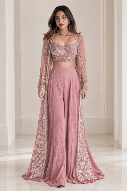 Model wearing dusty pink embroidered 3-piece palazzo set with matching sheer cape jacket