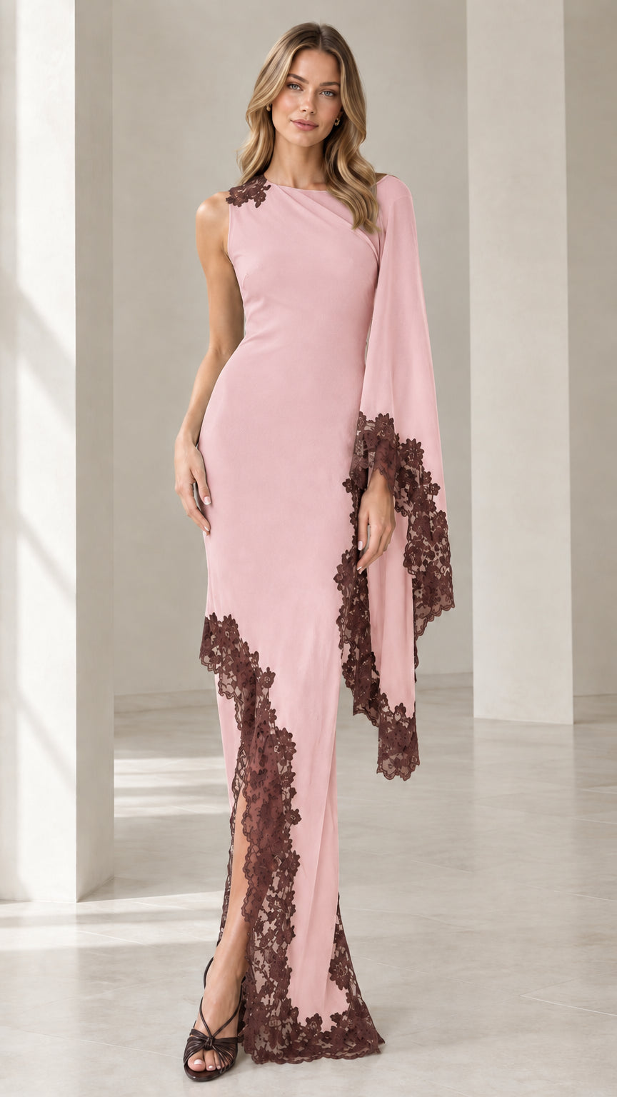 Front view of blush pink asymmetric cape sleeve formal dress with contrast brown lace trim