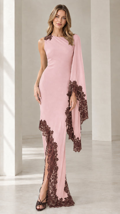 Front view of blush pink asymmetric cape sleeve formal dress with contrast brown lace trim