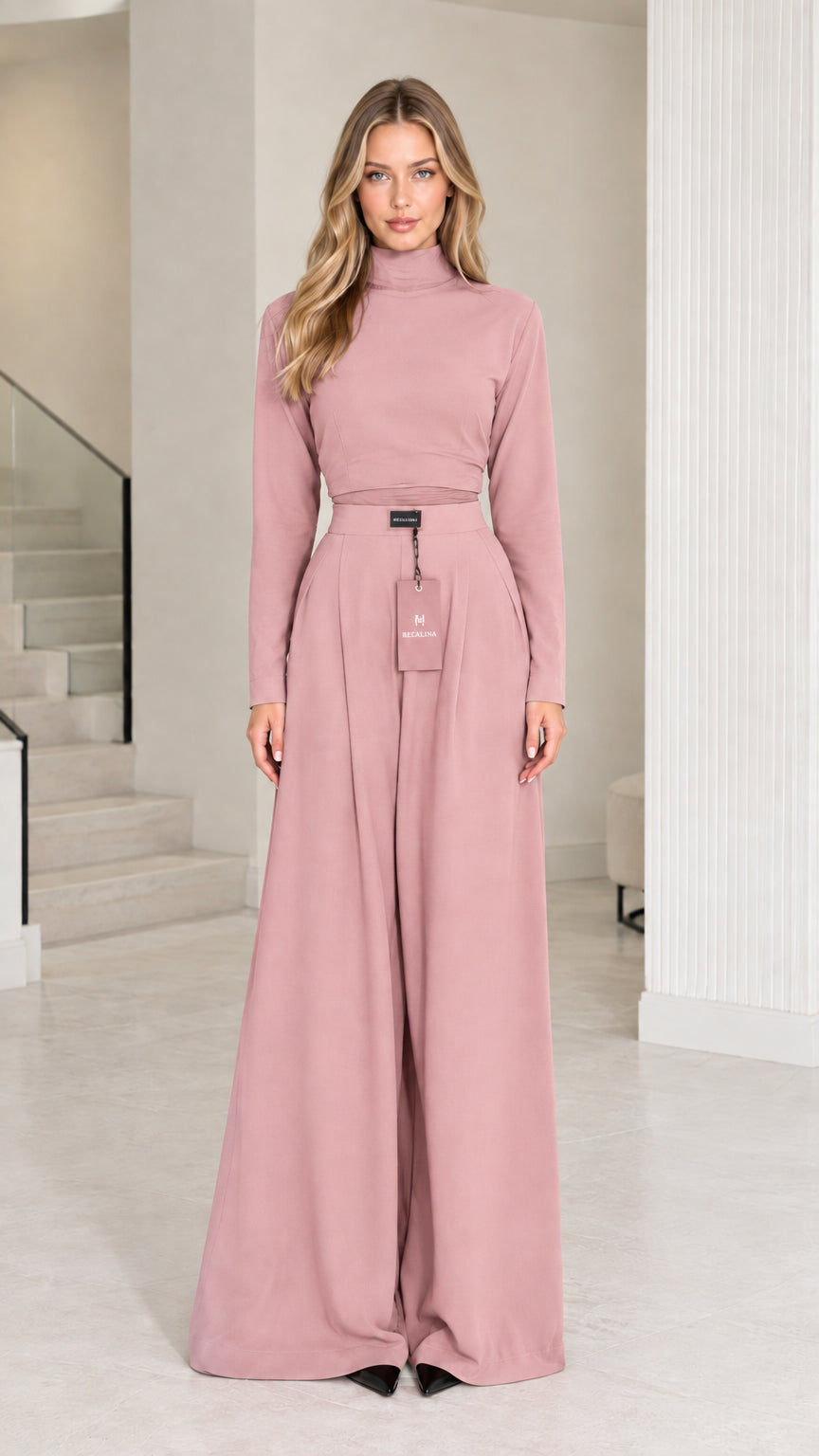 Front view of model wearing dusty pink mock neck top and matching palazzo pants set