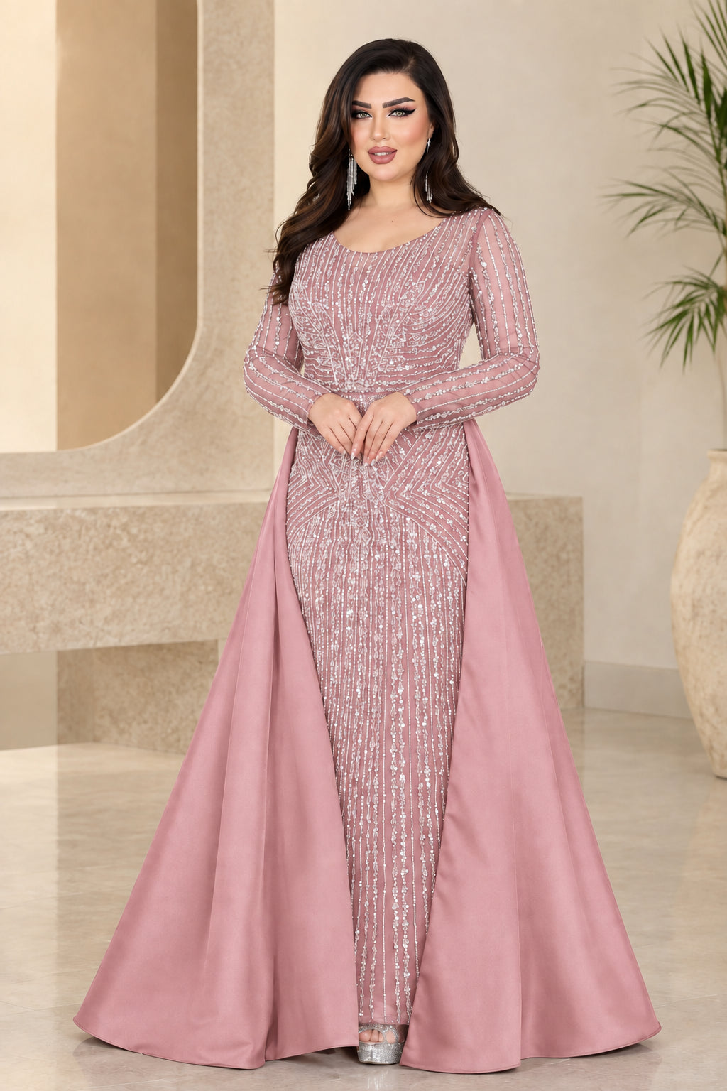 Dusty pink embellished long-sleeve formal gown with dramatic overskirt
