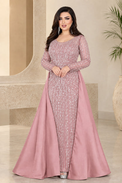 Dusty pink embellished long-sleeve formal gown with dramatic overskirt