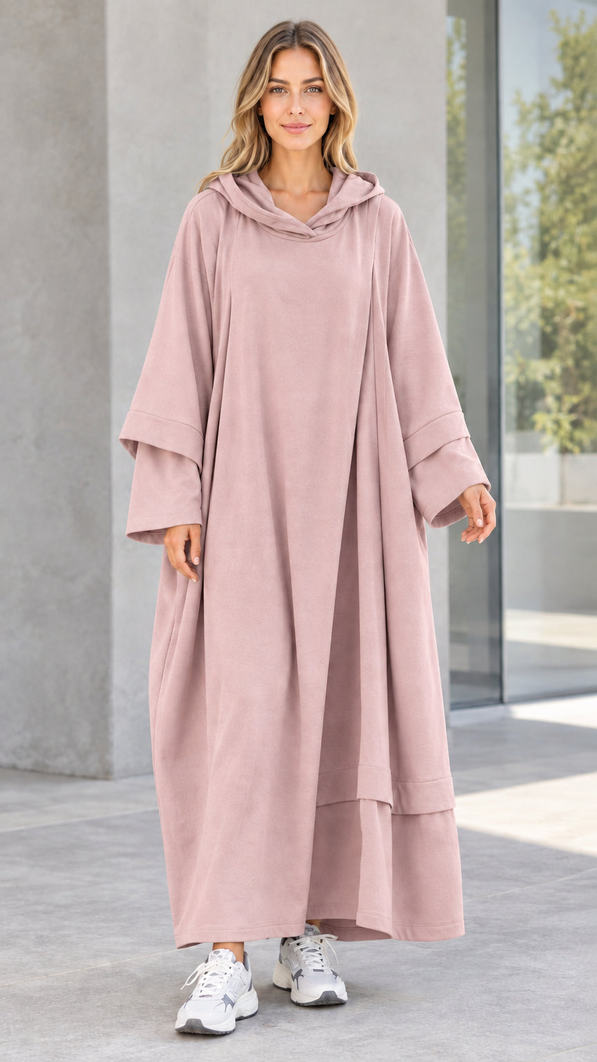 Front view of woman wearing dusty pink oversized hooded maxi dress