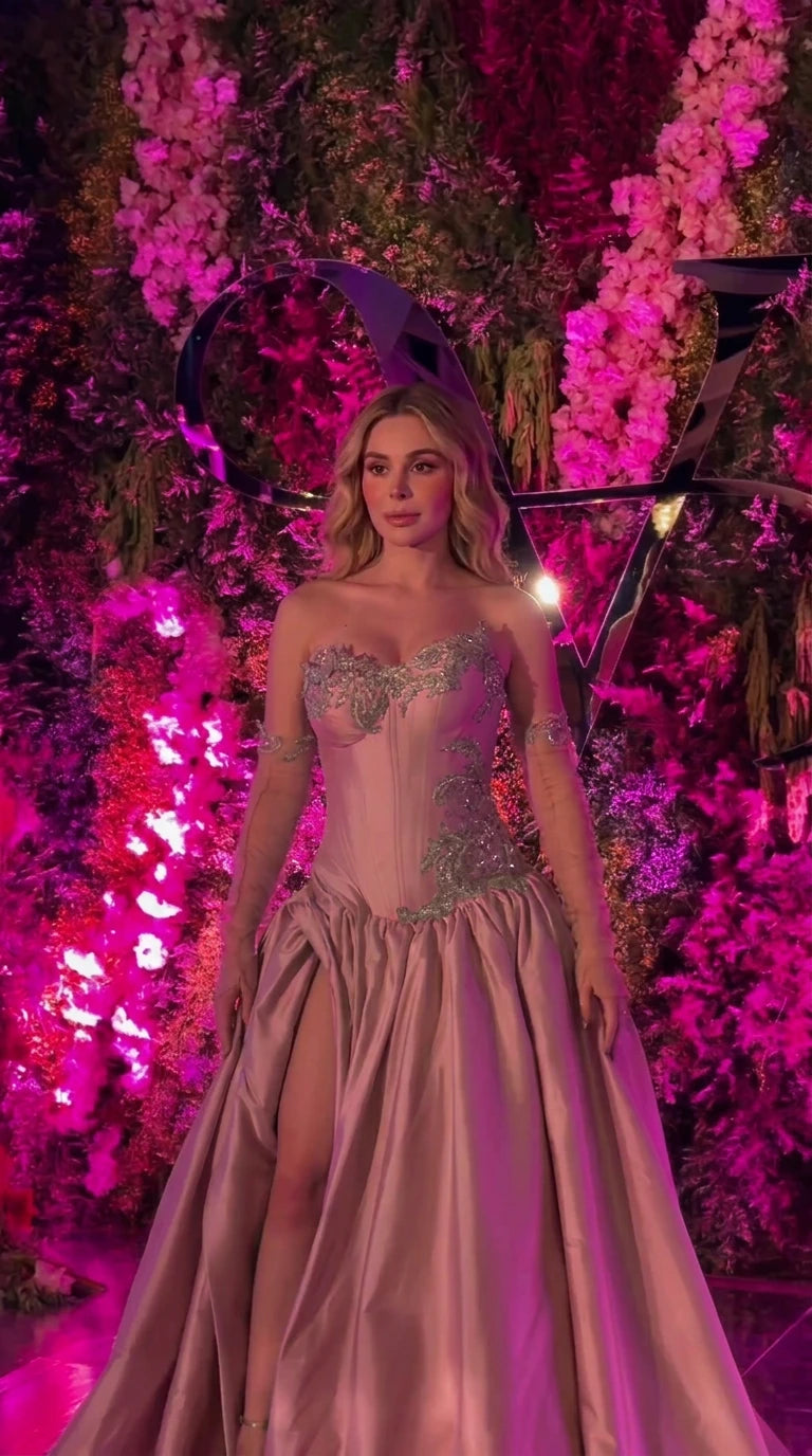 Front view of dusty rose pink strapless corset formal gown with beadwork