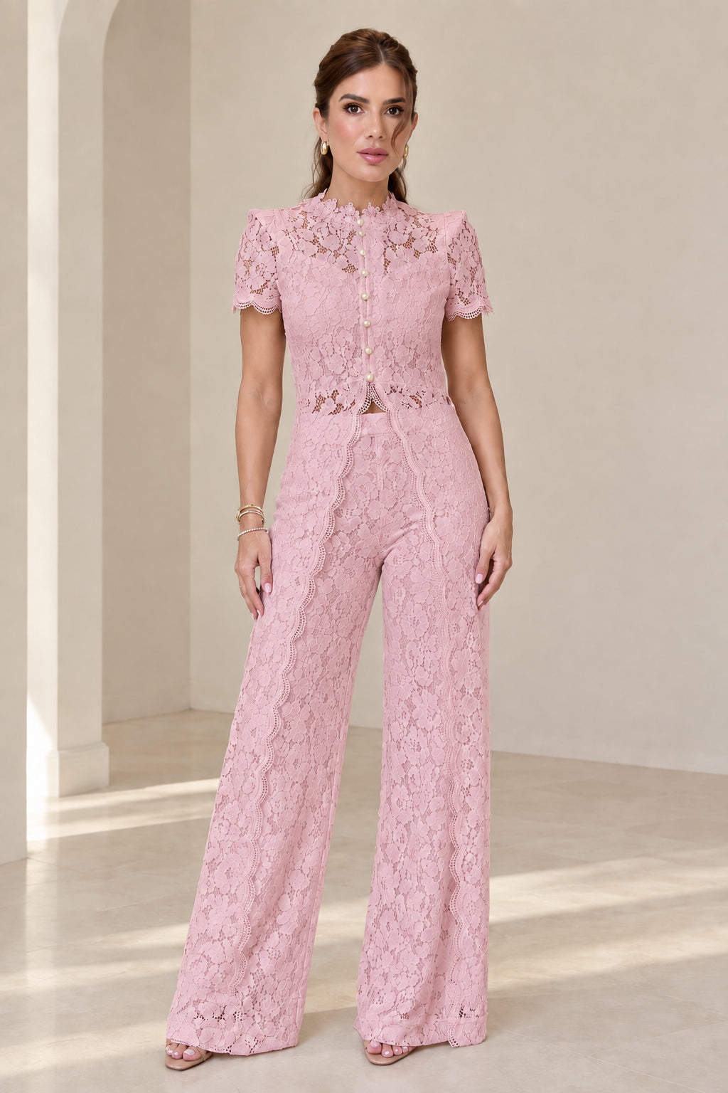 Model wearing blush pink floral lace two-piece pant suit set