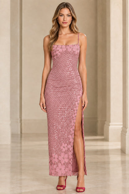 Front view of woman wearing dusty pink floral sequin floor-length gown