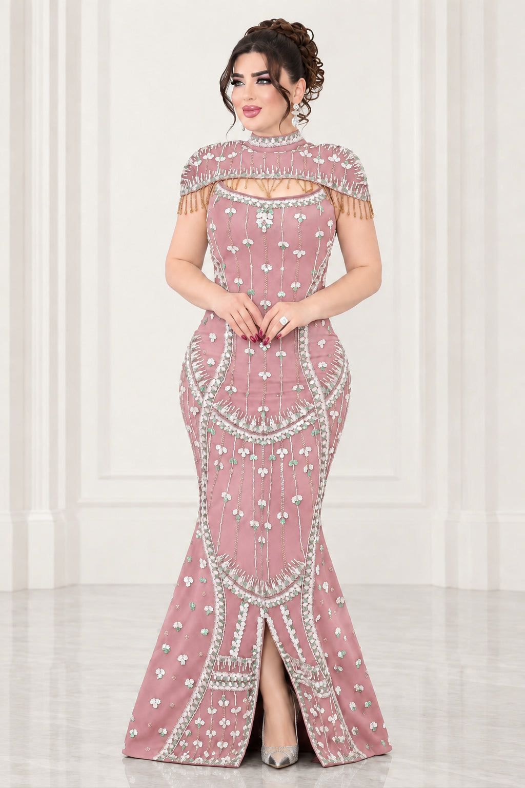 Full-length view of dusty pink rhinestone embellished mermaid formal gown with shoulder fringe
