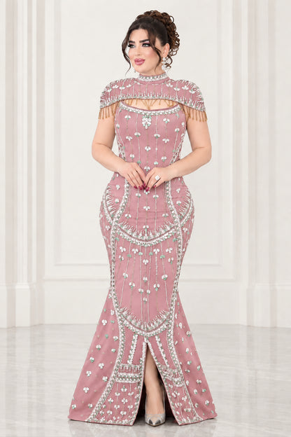 Full-length view of dusty pink rhinestone embellished mermaid formal gown with shoulder fringe