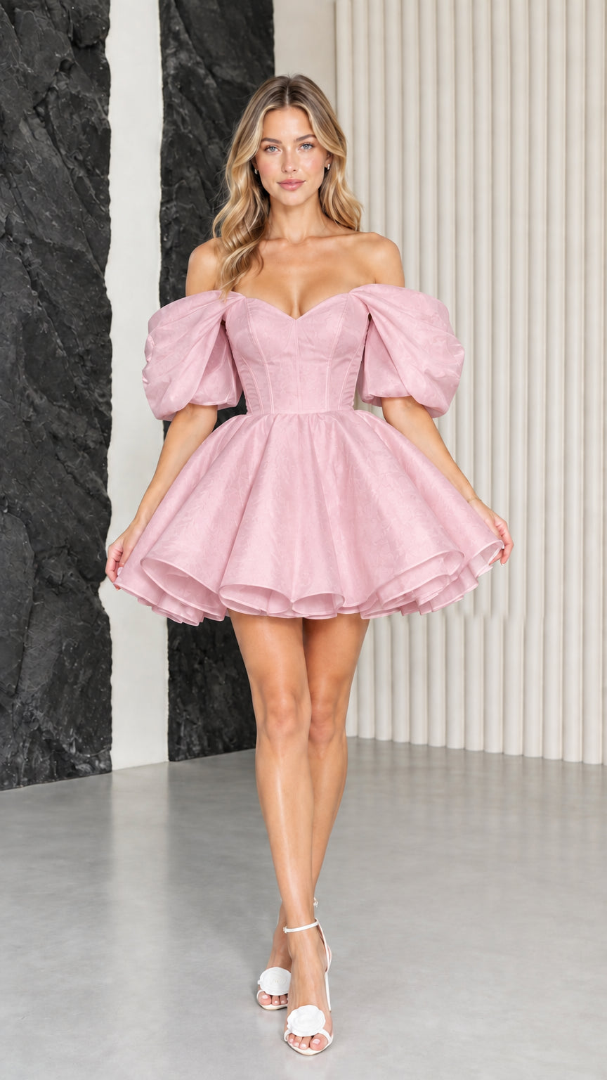 Model wearing blush pink off-the-shoulder corset puff sleeve mini dress