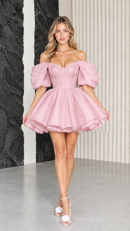 Model wearing blush pink off-the-shoulder corset puff sleeve mini dress