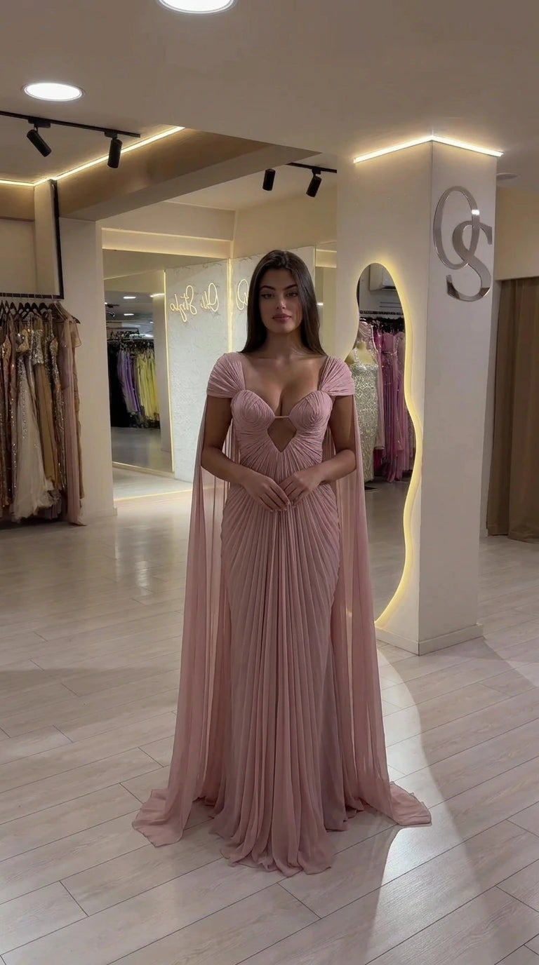 Front view of Dusty Pink pleated formal evening gown with cape drape
