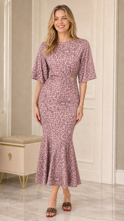 Model wearing Dusty Rose leopard print mermaid midi dress with fluted hem