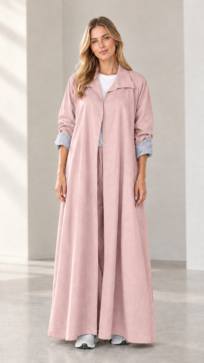 Full-length front view of woman modeling dusty pink long duster trench coat