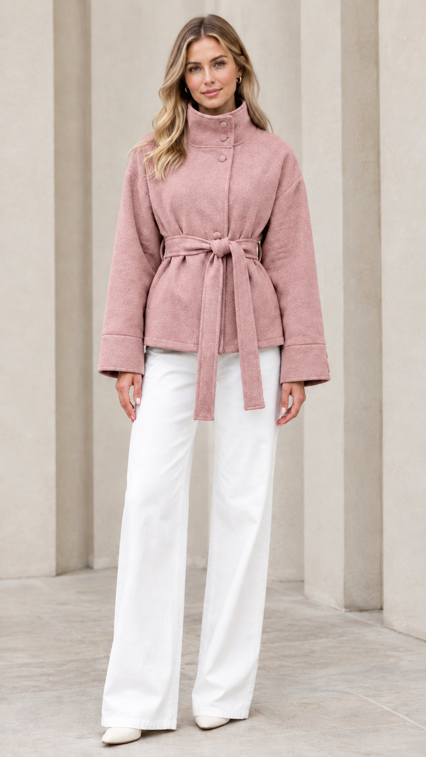 Front view of model wearing dusty pink stand collar belted short coat