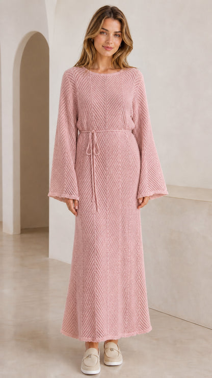 Front view of model wearing dusty pink textured knit bell sleeve maxi dress