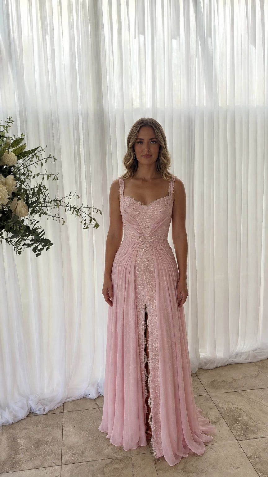 Front view of model wearing blush pink sweetheart neck chiffon evening gown