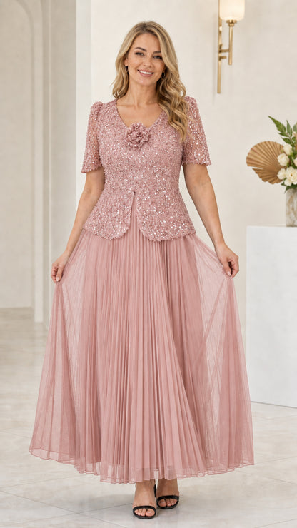 Front view of dusty rose sequin bodice and pleated tulle formal dress