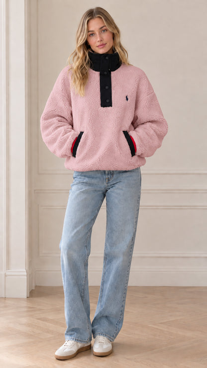Front view of model wearing pastel pink sherpa fleece snap-neck pullover