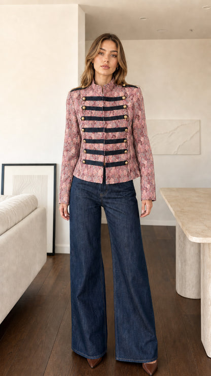 Front view of model wearing Dusty Pink jacquard military band jacket with black trim