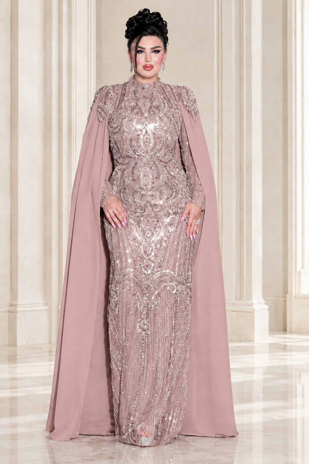 Model wearing dusty rose embellished high neck cape maxi dress
