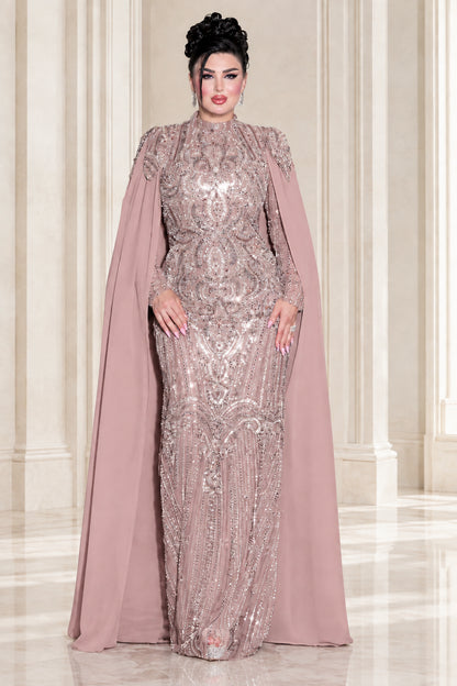 Model wearing dusty rose embellished high neck cape maxi dress