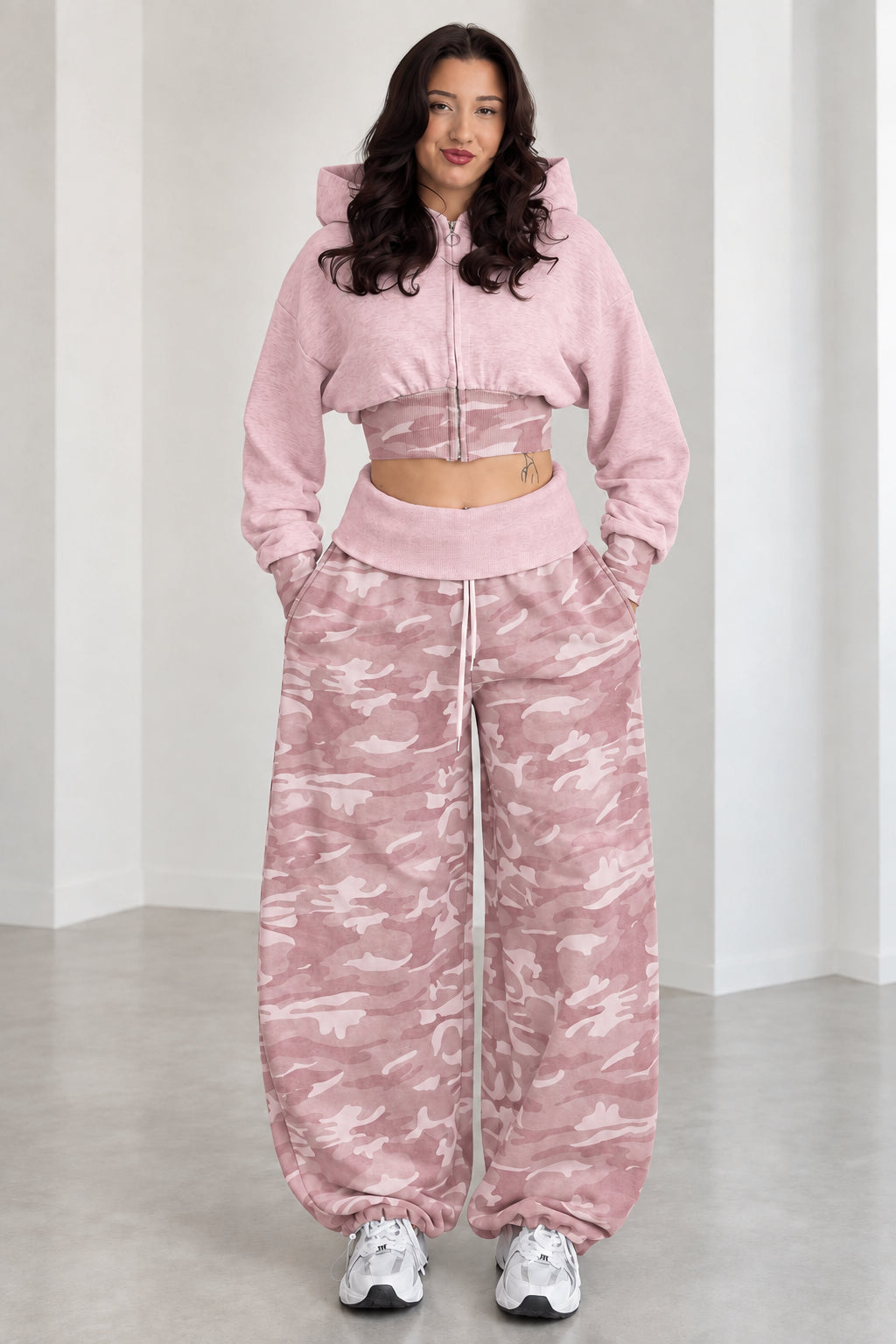 Model wearing Dusty Pink cropped zip hoodie and pink camouflage wide-leg sweatpants set