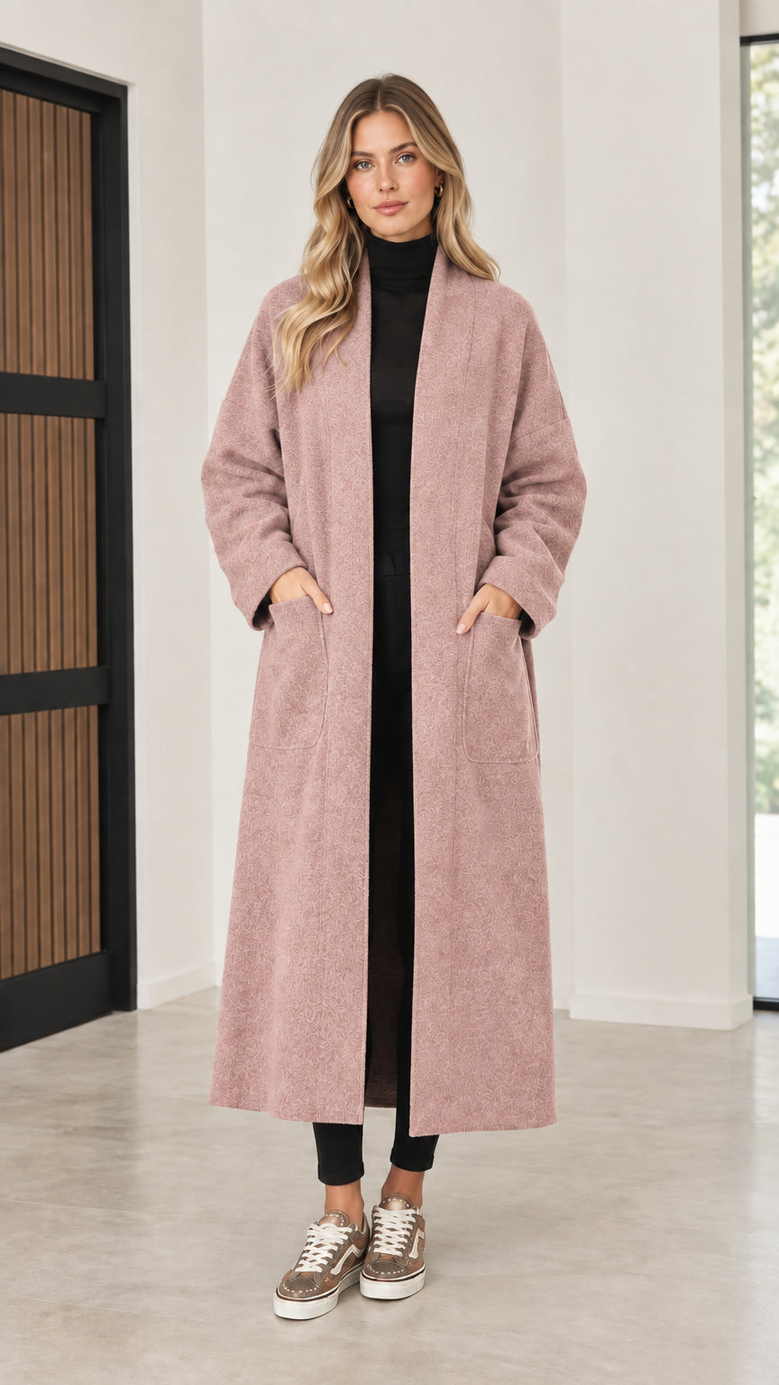 Front view of model wearing dusty pink open front maxi coatigan