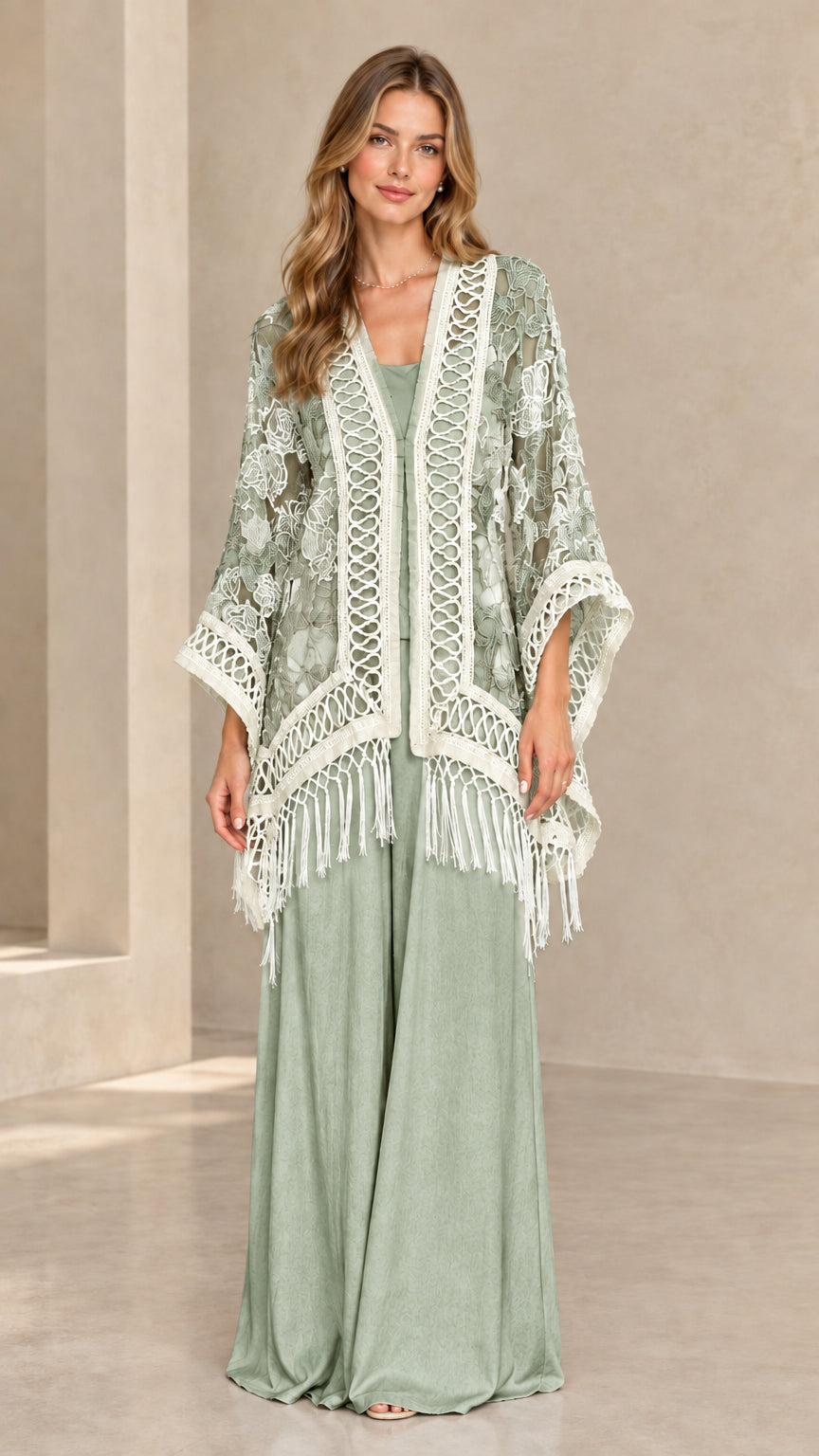 Woman wearing sage green floral lace fringe kimono cardigan with matching sage pants