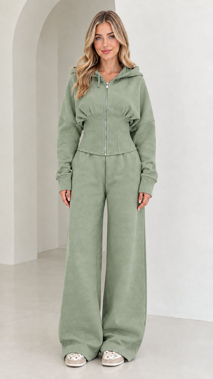 Full-length view of women's corset hoodie and wide-leg sweatpants set in Sage Green
