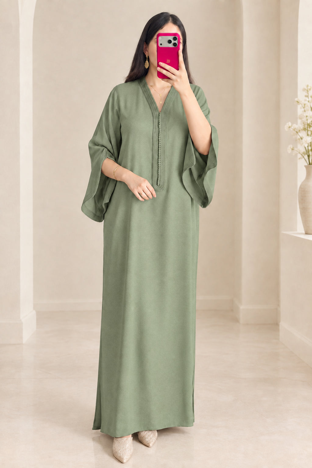 Front view of woman wearing sage green modest kaftan maxi dress