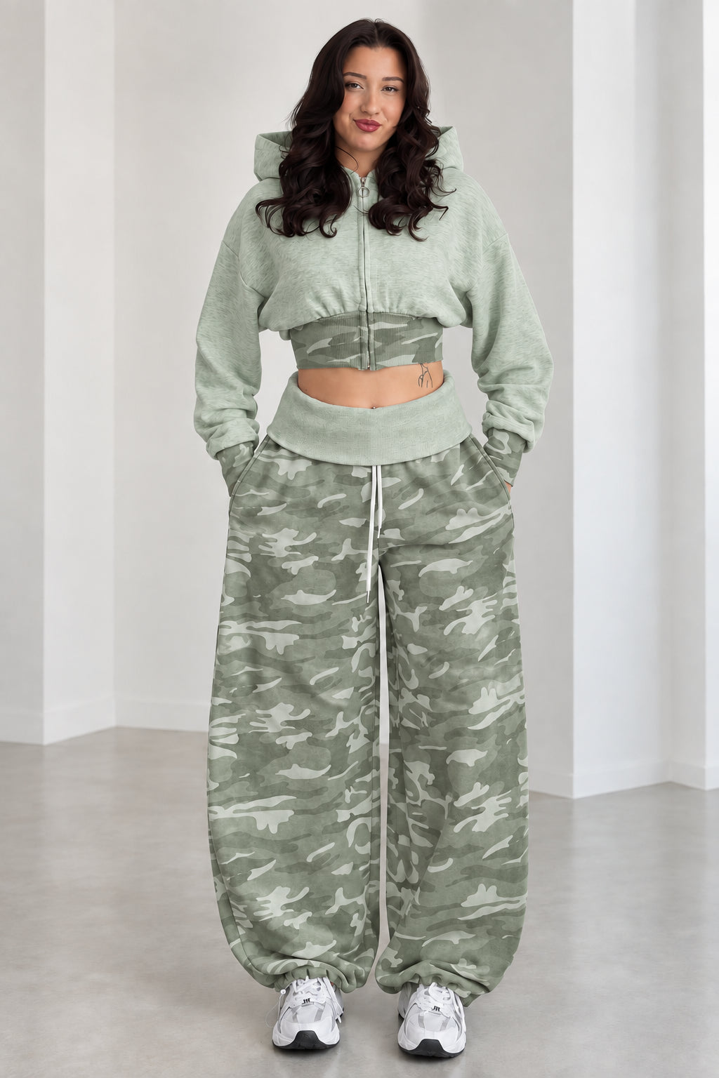 Model wearing Sage Green cropped zip hoodie and green camouflage wide-leg sweatpants set